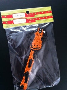 Image of hand beaded 'giraffe DJ' magnet