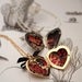 Image of heart locket with hand engraving