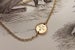 Image of gold disc bracelet with diamond 