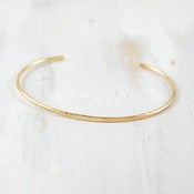 Image of simple gold forged cuff