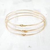 Image of gold bangles set of three