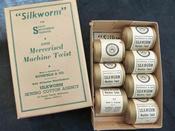 Image of Box (Qty 7) of light brown "Silkworm" threads (TX024)
