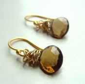 Image of tidal earrings with whisky topaz