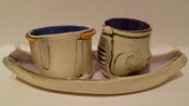 Image of Barb Campbell serving boat with cups