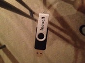 Image of Incwell 1G USB thumb drive with music