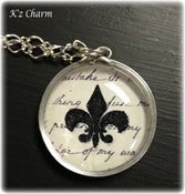 Image of Round Black Fleur de lis Charm