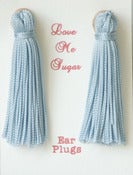Image of Holly Golightly styled long tassel earplugs