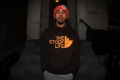 Image of THE STOOP LIFE BROWN HOODY GLOW IN THE DARK NEON ORANGE PRINT 