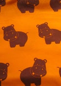 Image of Orange hippos cotton interlock (by half metre)