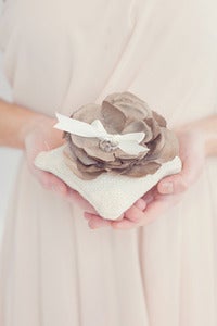 Image of Burlap ring bearer pillow topped with handmade silk flower
