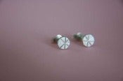 Image of tiny round silver studs