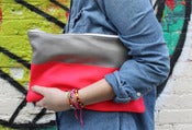 Image of neon color block clutch