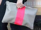 Image of neon vertical stripe clutch