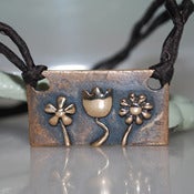 Image of Bronze Flower Trio Pendant on Silk
