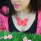 Image of Large UV Pink laser cut acrylic butterfly necklace