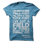 Image of Alcopop ‘A Field of Ponies’ white on sky blue tee