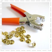 Image of Eyelet Pliers with 100 eyelets included.