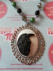 Image of Black Crow Bird Cameo Necklace on Rosary Style Green, Black, Dark Grey Clear Beads