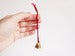 Image of Indian Bell with Handknitted String