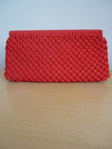 Image of red macramé clutch