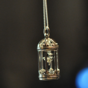 Image of Sterling silver birdcage with moving bird pendant