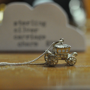 Image of Sterling silver carriage with moving wheels