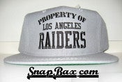 Image of VINTAGE PROPERTY OF LA RAIDERS NEW ERA SNAPBACK CAP