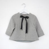 Image of black bow vest