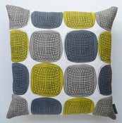 Image of Twister cushion in blue on white linen