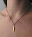 Image of zgolden goose feather with ruby by Swallow