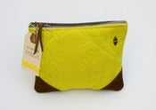Image of yellow zip pouch with brown suede corners