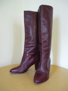 Image of burgundy leather knee high boots
