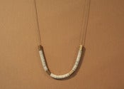 Image of Sequins and brass