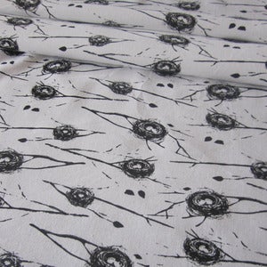 Image of Nests on natural organic cotton