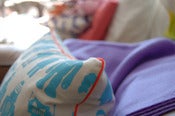 Image of robots pillow with piping