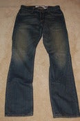 Image of Levi's 514s brown distressed