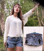 Image of Short en jeans avec croix en cuir.