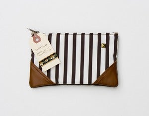 Image of -SOLD OUT- a small chocolate + vanilla striped zipper pouch with leather corners