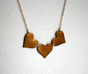 Image of Three Brass Hearts