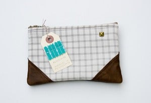 Image of -SOLD OUT- a small black + cream grid print zipper purse with leather corners
