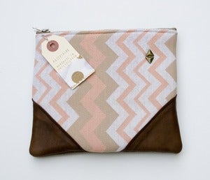 Image of -SOLD OUT- a chevron striped zipper clutch with leather corners and a METAL zipper