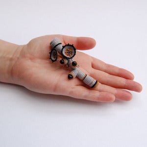 Image of Striped grey, mustard and black coral brooch