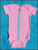 Image of pink ribbon onesie