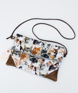 Image of -SOLD OUT- a foldover clutch in CATS! print with a removable strap!