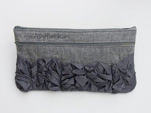 Image of - S O L D - a tough ruffles zip clutch a-go-go in two shades of grey (a)