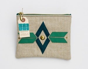 Image of large zipper pouch with geometric leather appliques and a metal zipper (a)