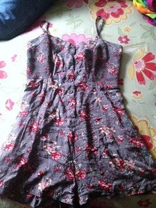 Image of Retro Styled Floral Print Romper with Unique Criss Cross Pattern in the back