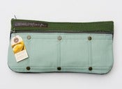 Image of a double zip clutch in wintergreen + pine