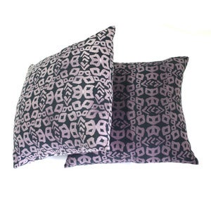 Image of blueish black and purple printed pillow