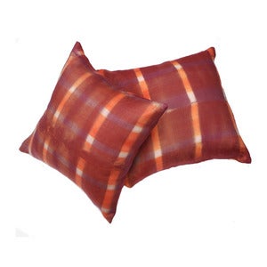 Image of orange and purple plaid pillow